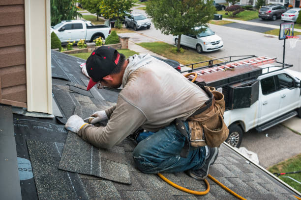 Professional Roofing technician working in Stovall, NC